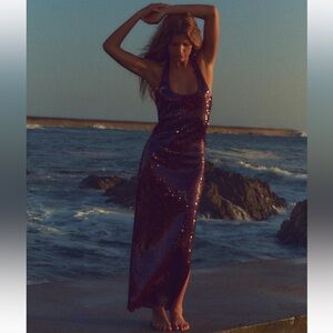 NWT Burgundy sequin dress with round neck halter and side slit.